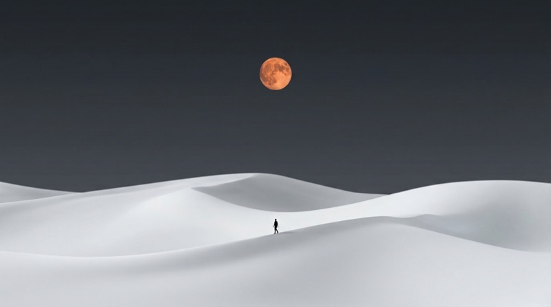 Lone Figure on White Sand Dunes Under Full Moon