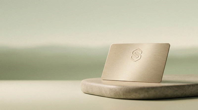 Minimal metallic card on stone pedestal