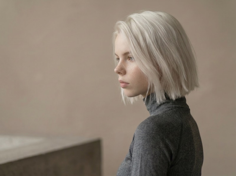 Minimalist side-profile portrait of blonde woman