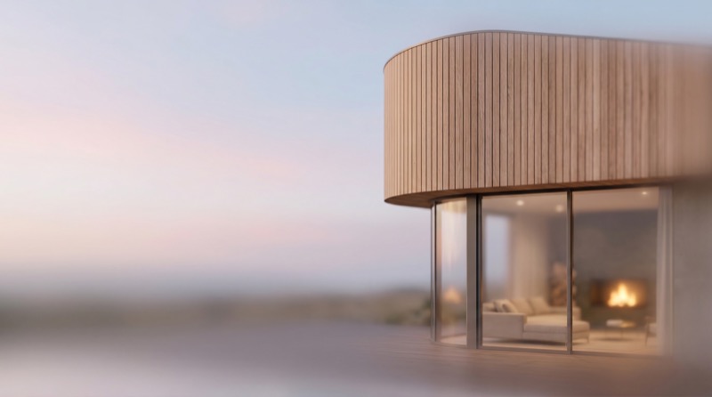 Modern curved house exterior at dusk