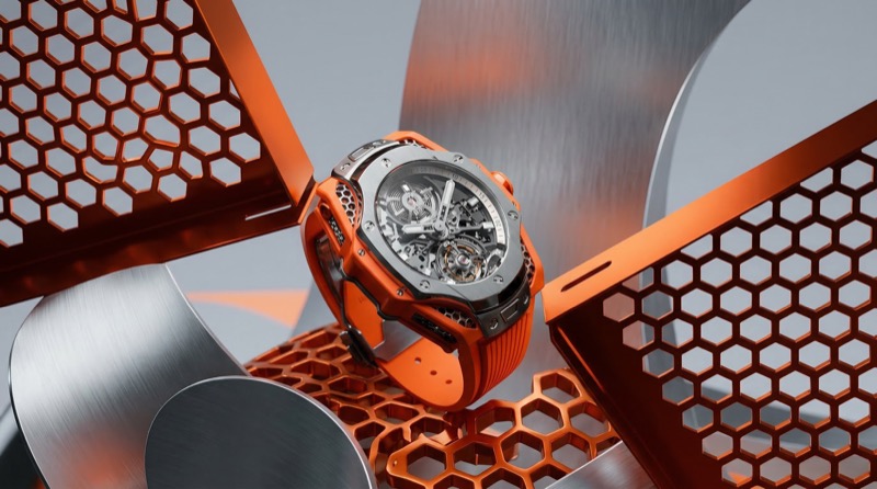 Orange skeleton watch on metallic honeycomb set