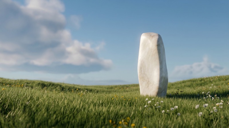 Standing Stone Monolith in Meadow Under Blue Sky