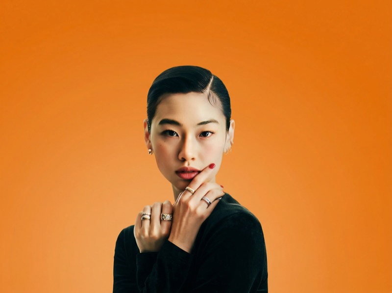 Studio portrait with orange gradient background
