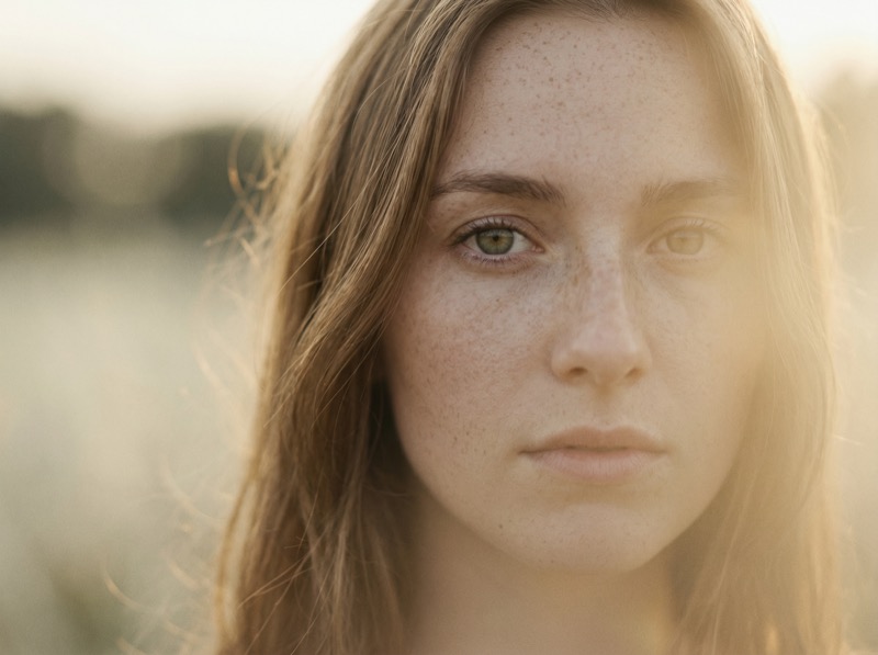 Sunlit close-up portrait with soft lens flare
