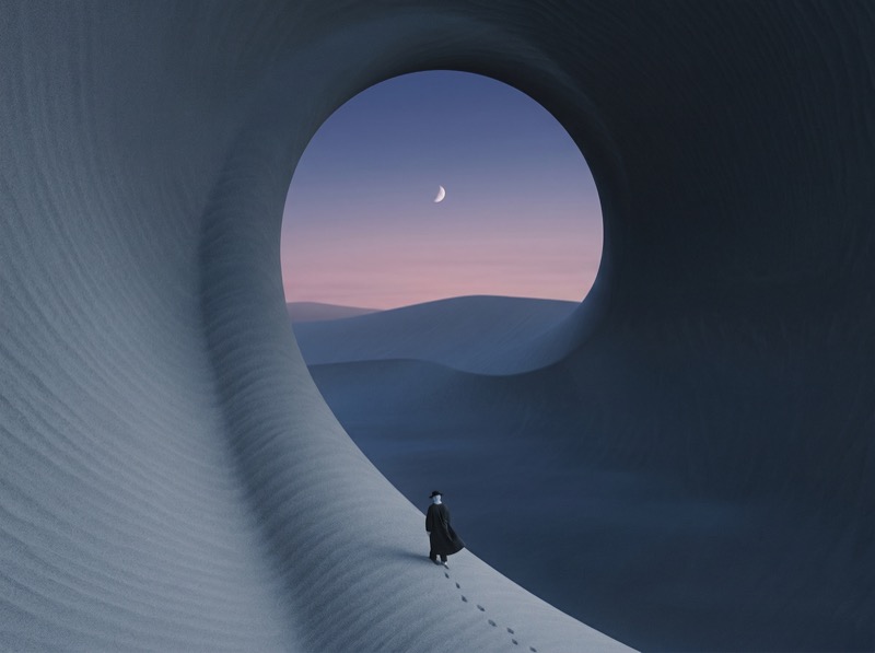 Surreal desert arch with lone figure at dusk