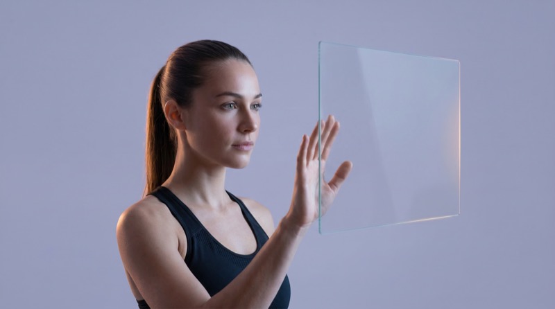 Woman using transparent touchscreen interface