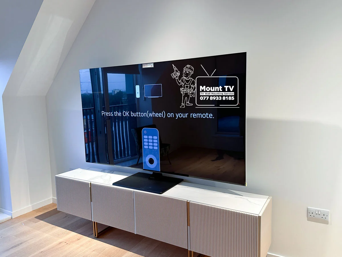 75" LG OLED TV installation — third angle, Canary Wharf