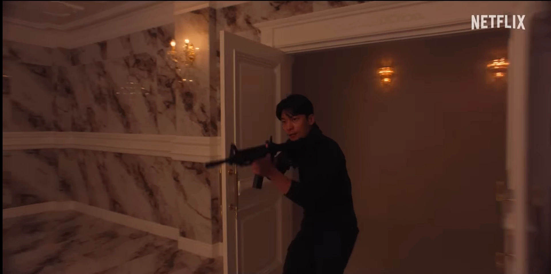 Junho busts open a door