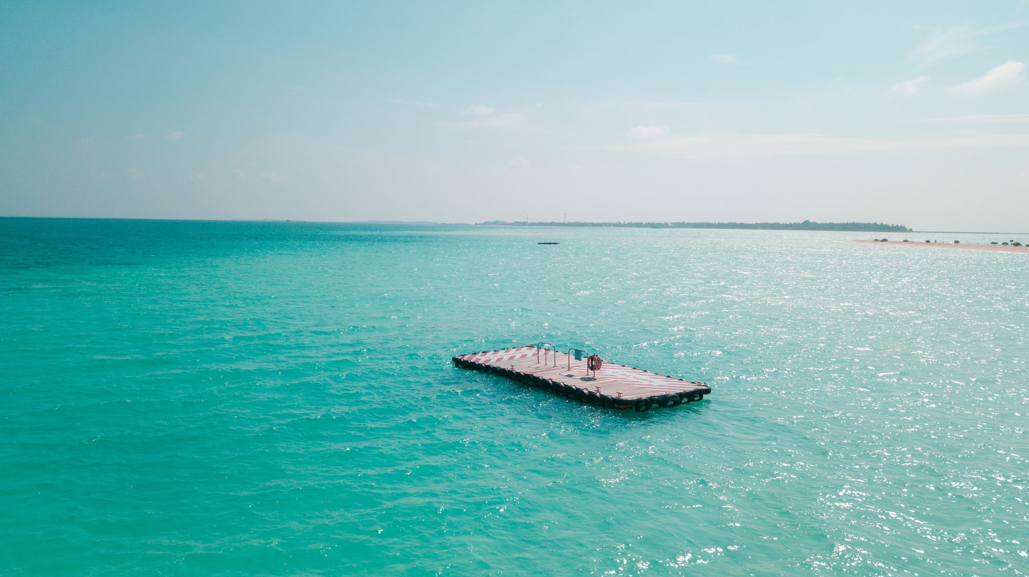 Floating platform on calm turquoise water (generic stock photo, temporary placeholder)