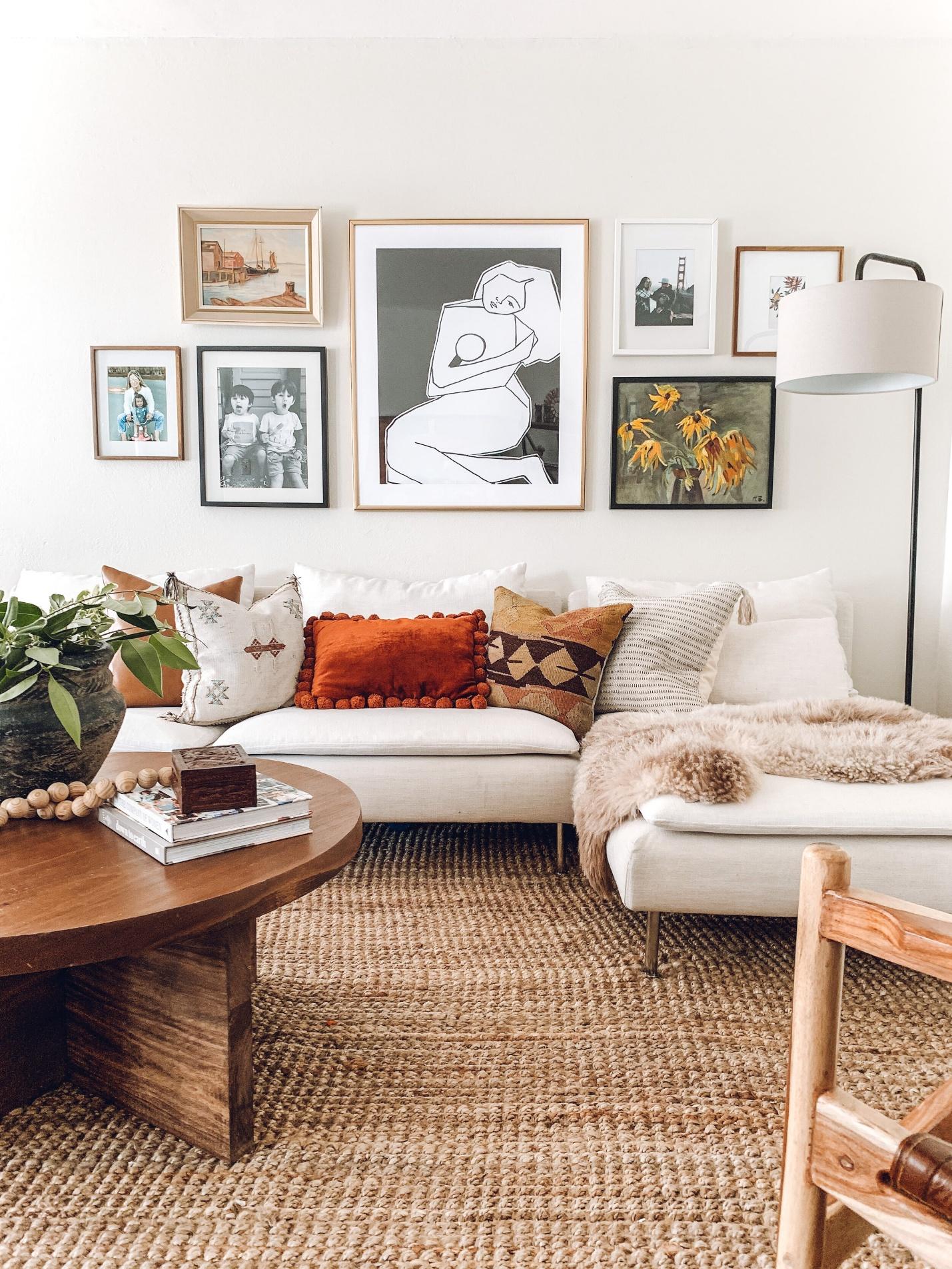 A living room with a couch and pictures on the wall

AI-generated content may be incorrect.