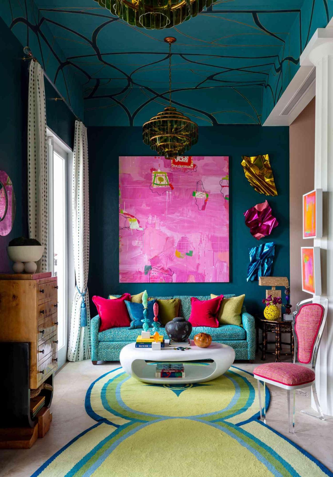 A room with a blue couch and a pink painting

AI-generated content may be incorrect.