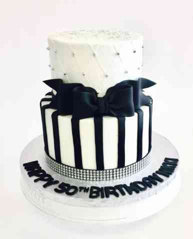 BLACK AND CREAM 2 TIER FONDANT CAKE 