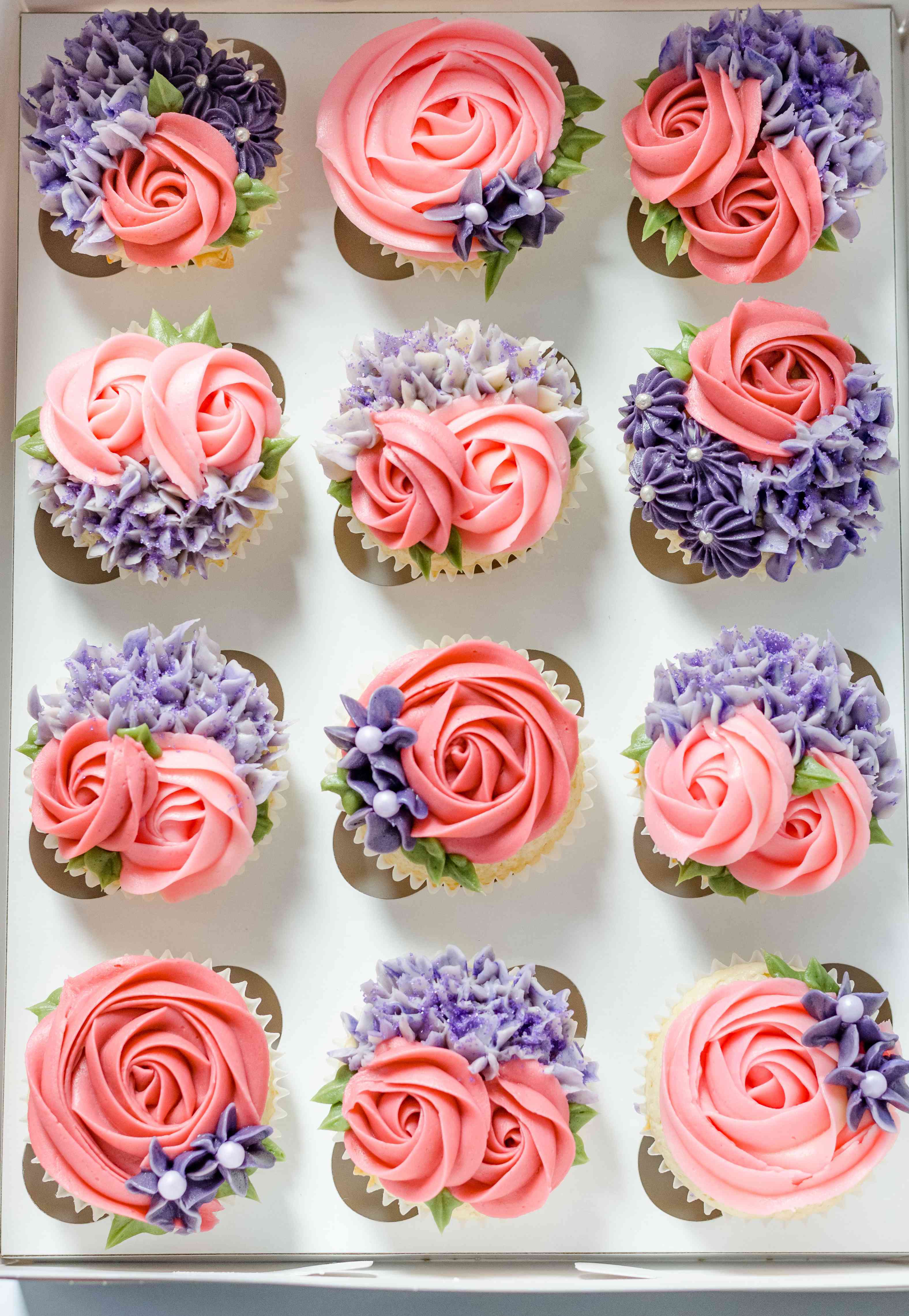 A DOZEN OF MIXED FLAVORS OF CUPCAKES .