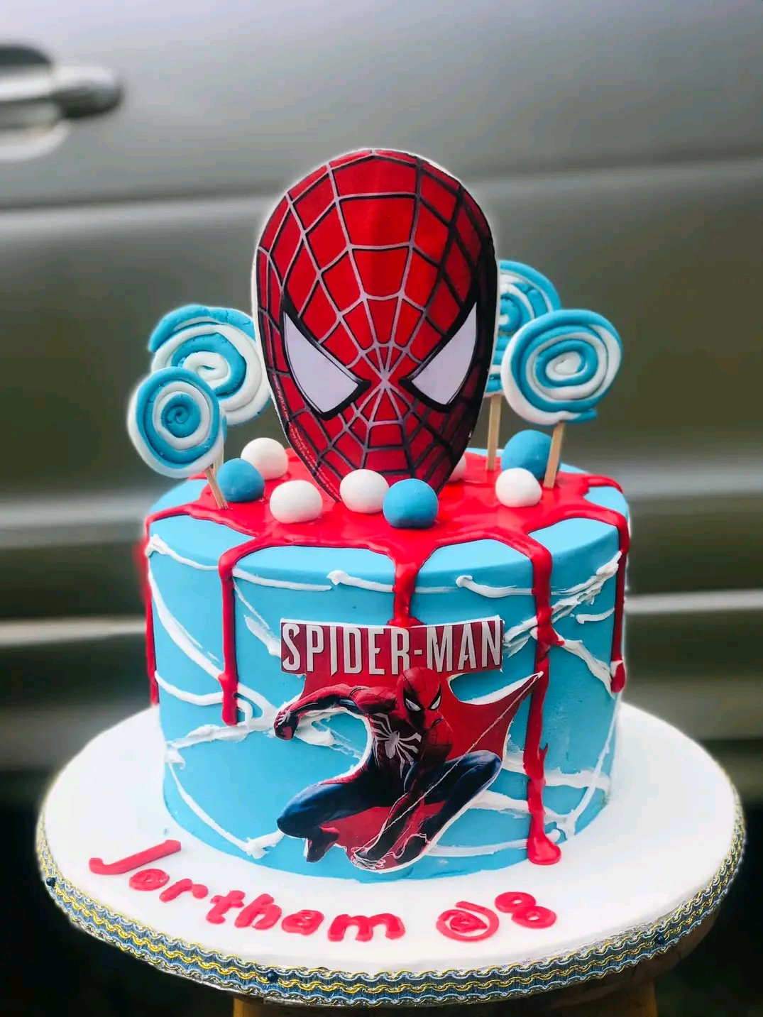 BLUE RED DRIPPED CHARACTER CAKE 