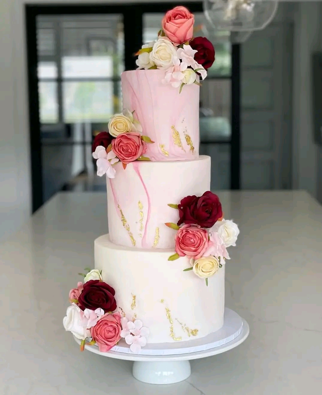 3 TIER ,CREAMY PEACH FLORAL CAKE 