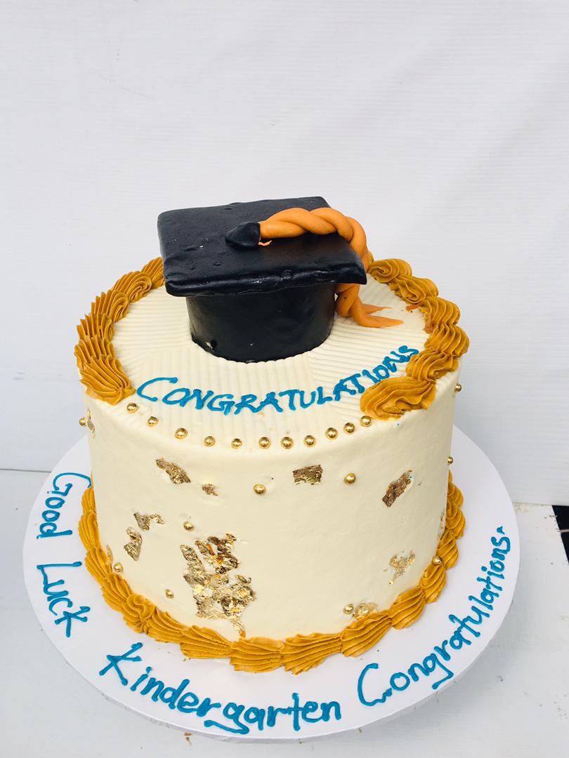 BROWN CREAM GRADUATION CAKE $1544