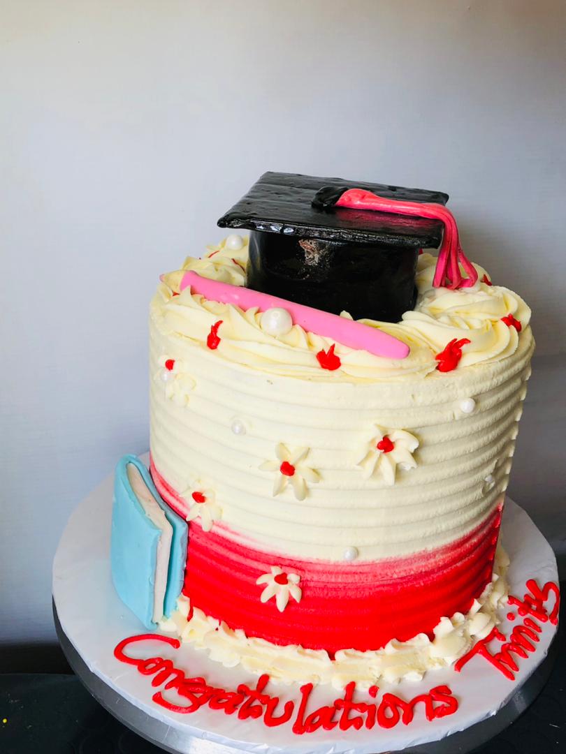 RED AND CREAM GRADUATION CAKE 