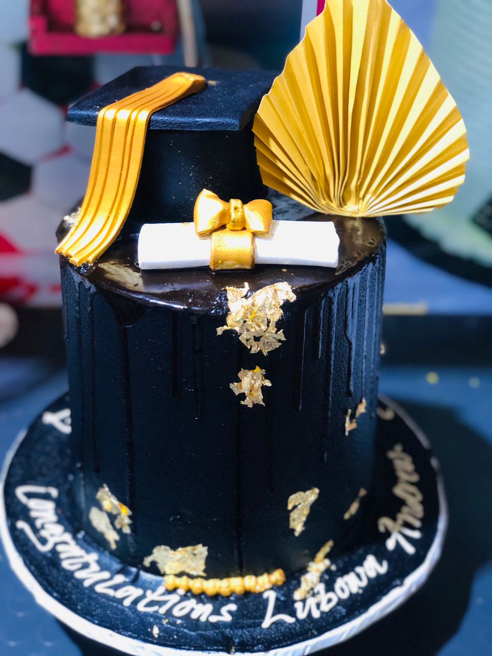 GOLD AND BLACK THEMED GRADUATION CAKE 