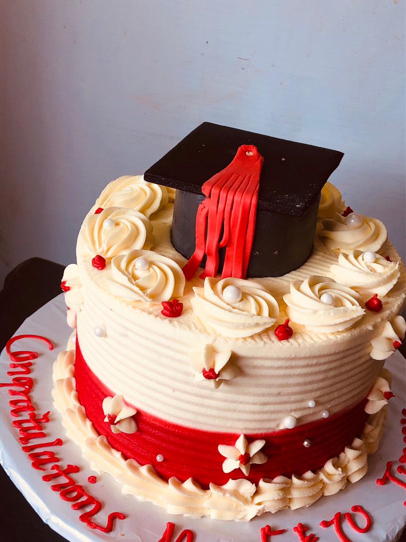 RED CREAM GRADUATION CAKE 