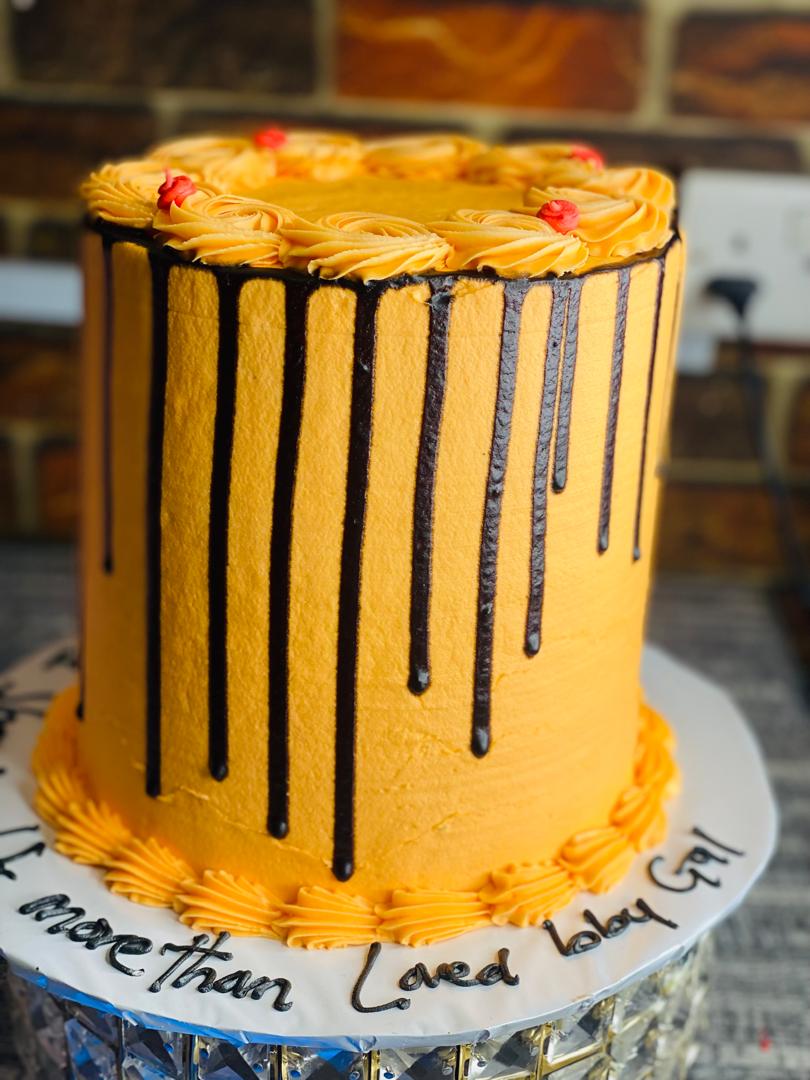 ORANGE AND BLACK BIRTHDAY CAKE..