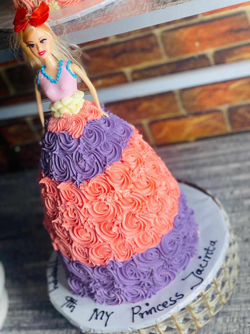 DOLL CAKE WITH PURPLE AND PINK ICING 