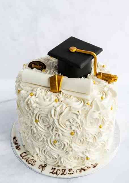 CREAM FLOWERED GRADUATION CAKE