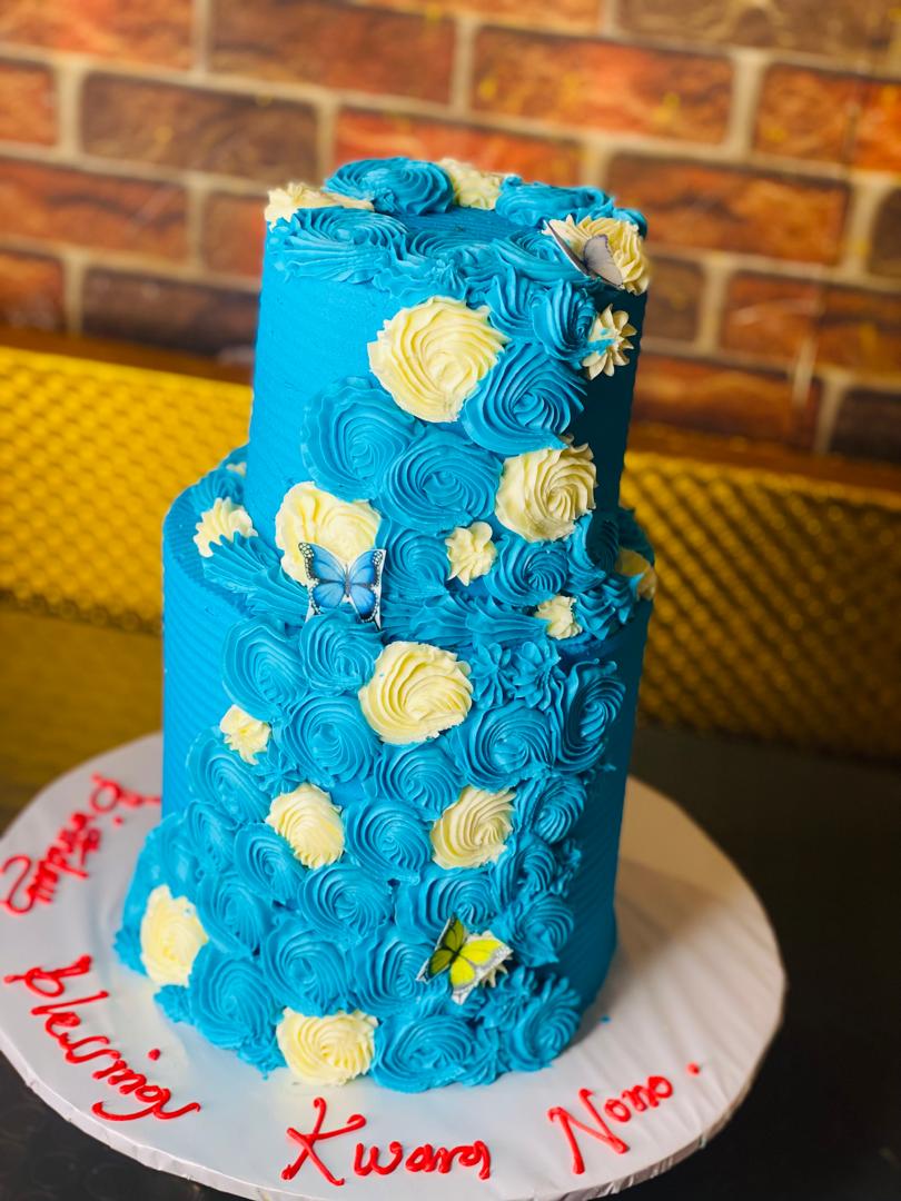 BLUE AND CREAM TIER BIRTHDAY CAKE 