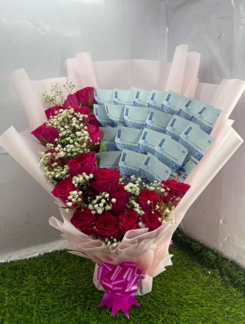 RED ROSES MONEY FLOWER IN A PINK RAPPER 