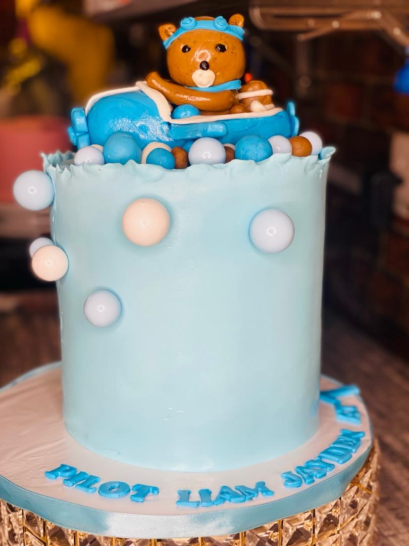 IT'S A BOY BABY SHOWER CAKE WITH A DOLL