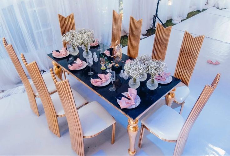 black and gold table and chair setting 