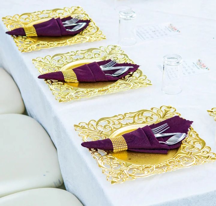 purple napkins and golden charger plates 