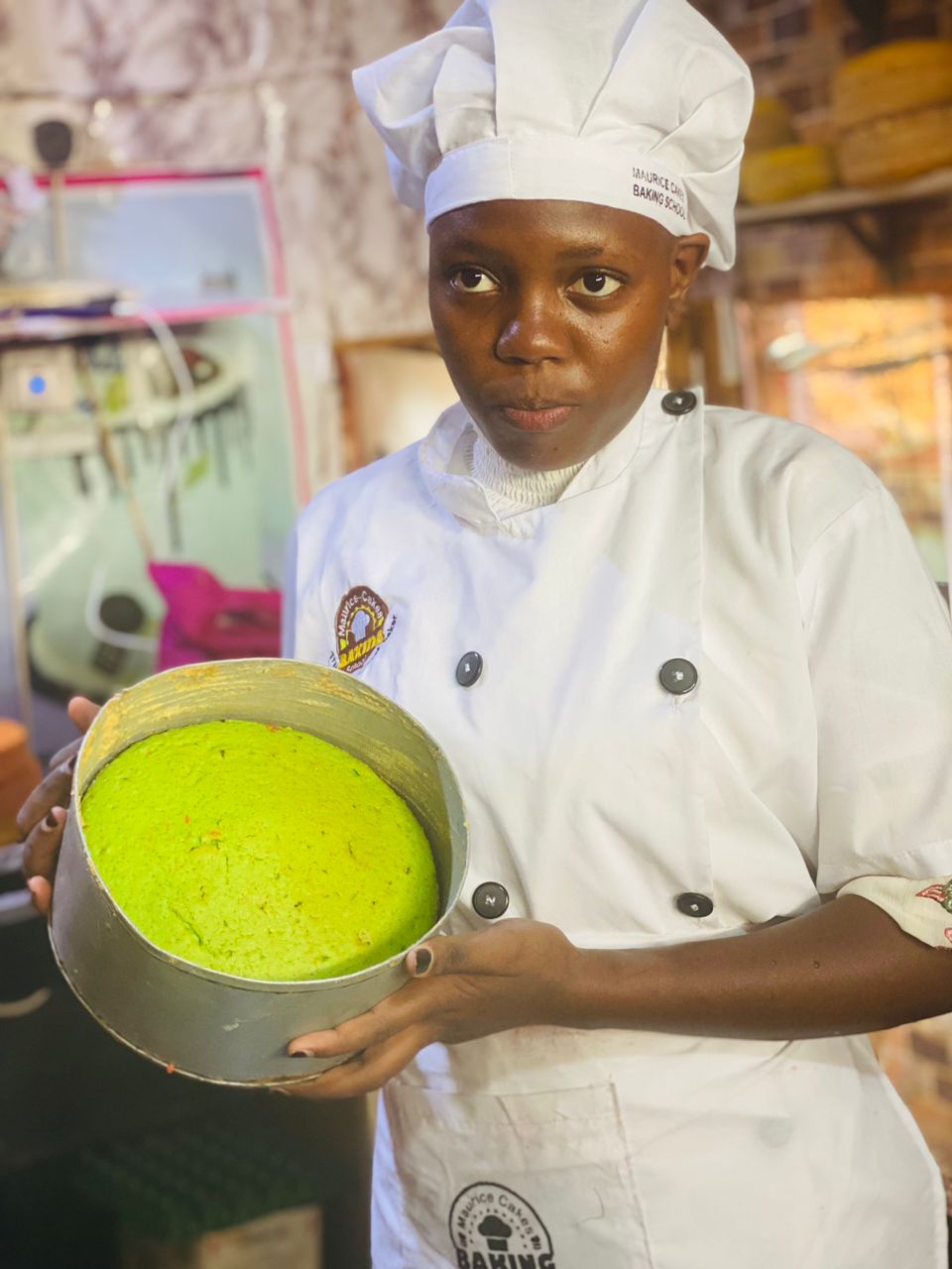 Our student Lairah showing her fully baked cake 