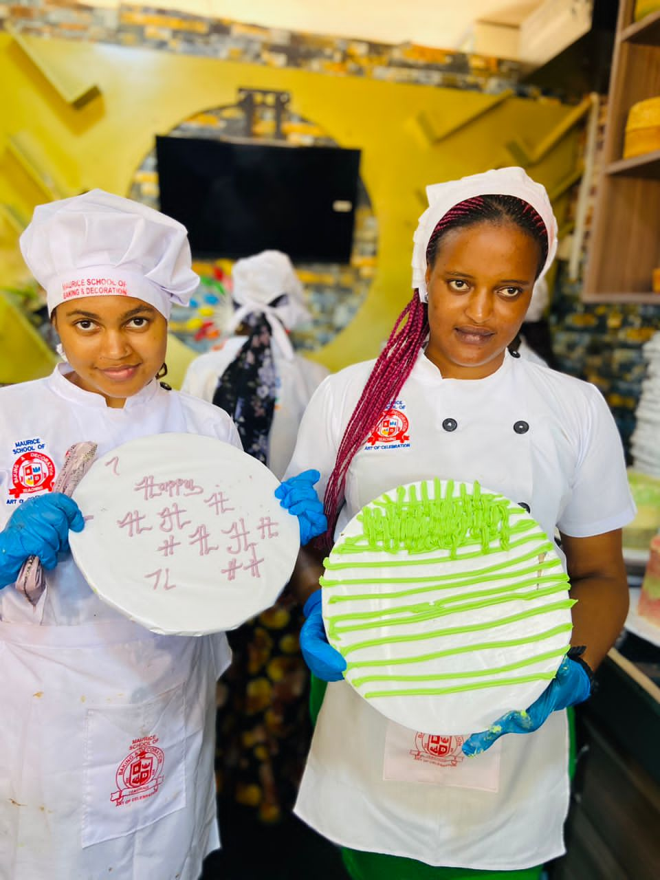 Our students Sheila and Jessica showing their cake writing and nozzle decorating progress 