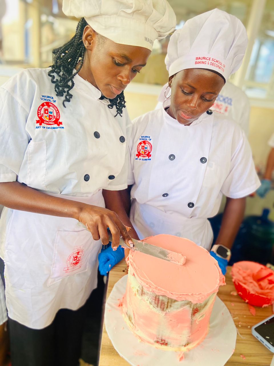 Our student Sumin taking on the cake designing lessons with teacher Sauda