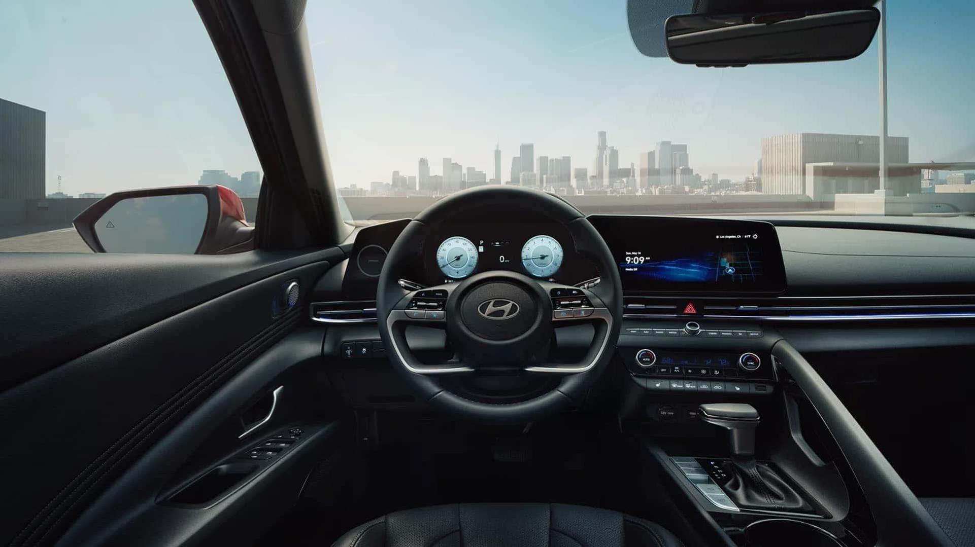 The modern digital cockpit of the Elantra features advanced dual-screen displays and integrated smartphone connectivity.