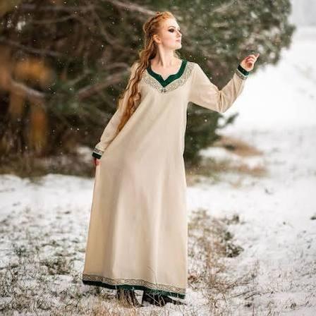 The intricate frost-like embroidery of her garments visually mirrors the chilly elegance of her homeland.