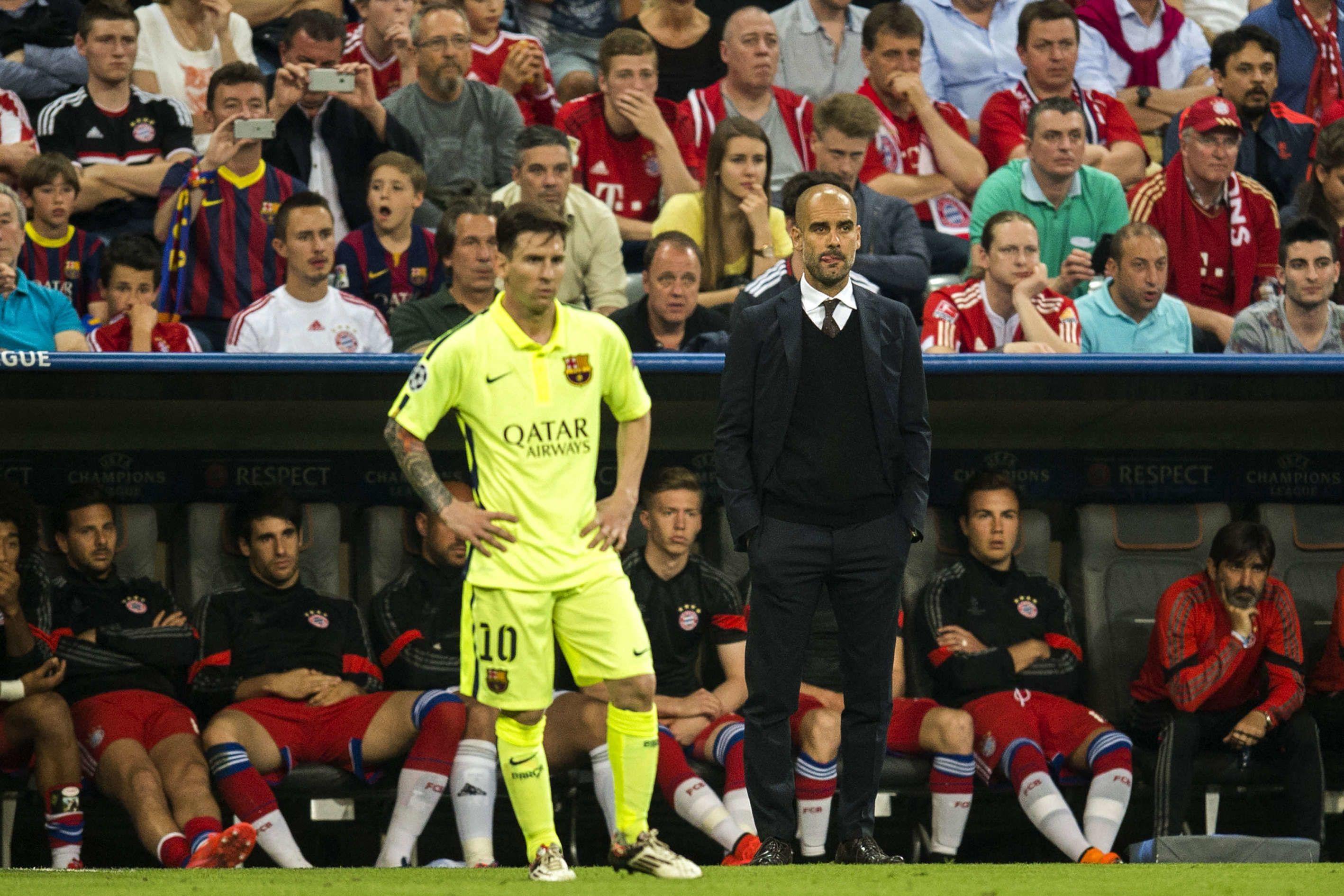 Pep Guardiola and Lionel Messi discussing tactics during a Barcelona match.