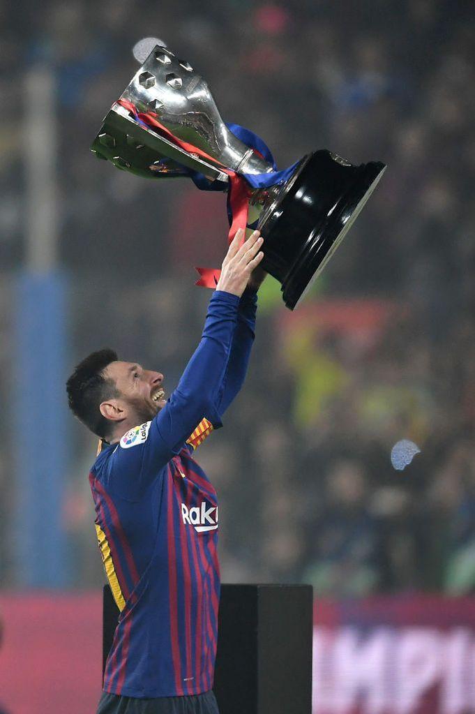 Lionel Messi celebrating a La Liga title triumph with FC Barcelona.