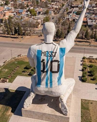 Fans honoring Lionel Messi's historic career inside a crowded stadium.