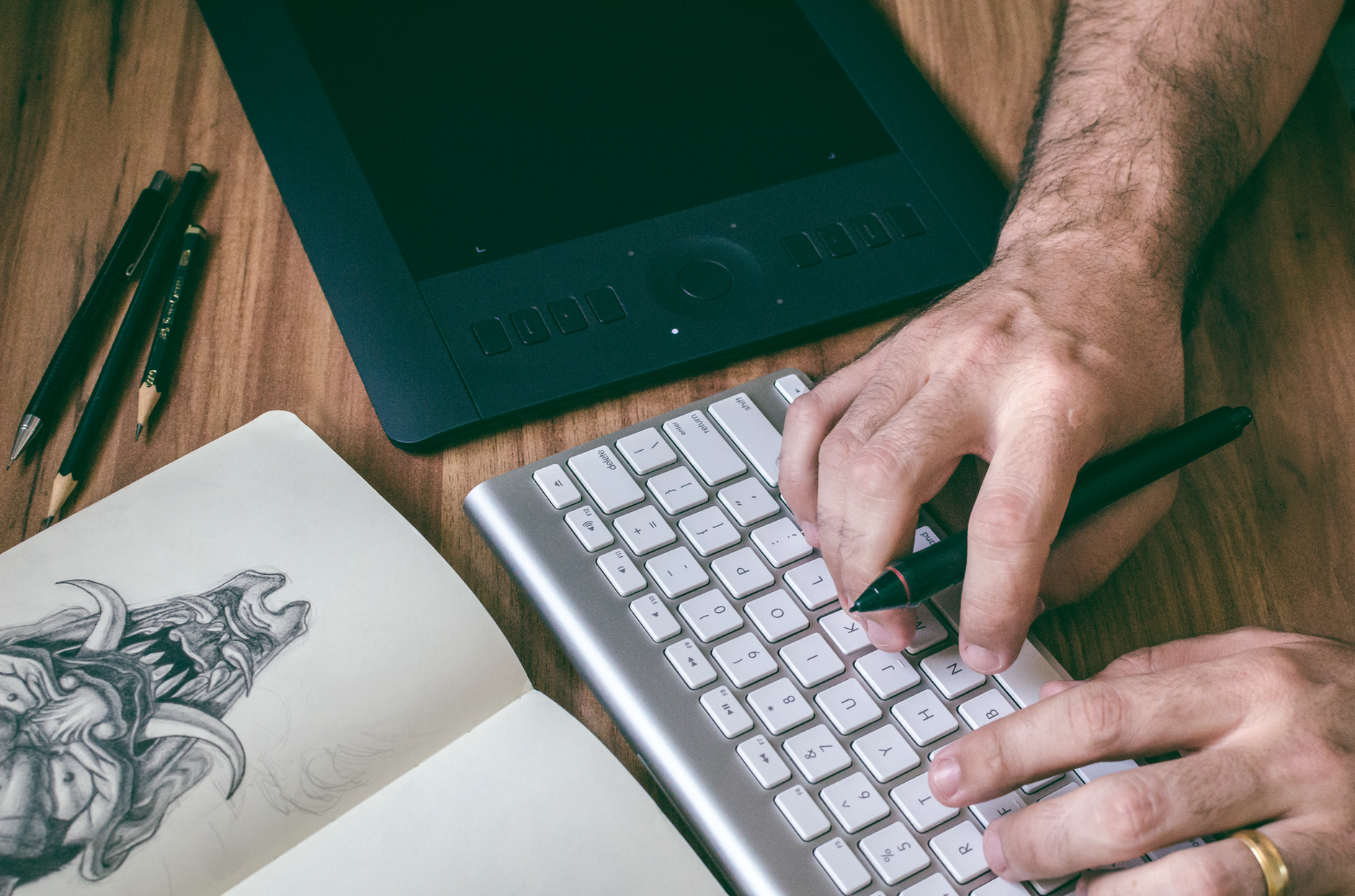 General visual reference for The Unsung Heroes Behind the Creative Output. Source: Pexels / Photo by MESSALA CIULLA / Pexels License / https://www.pexels.com/photo/person-using-magic-keyboard-1055731/