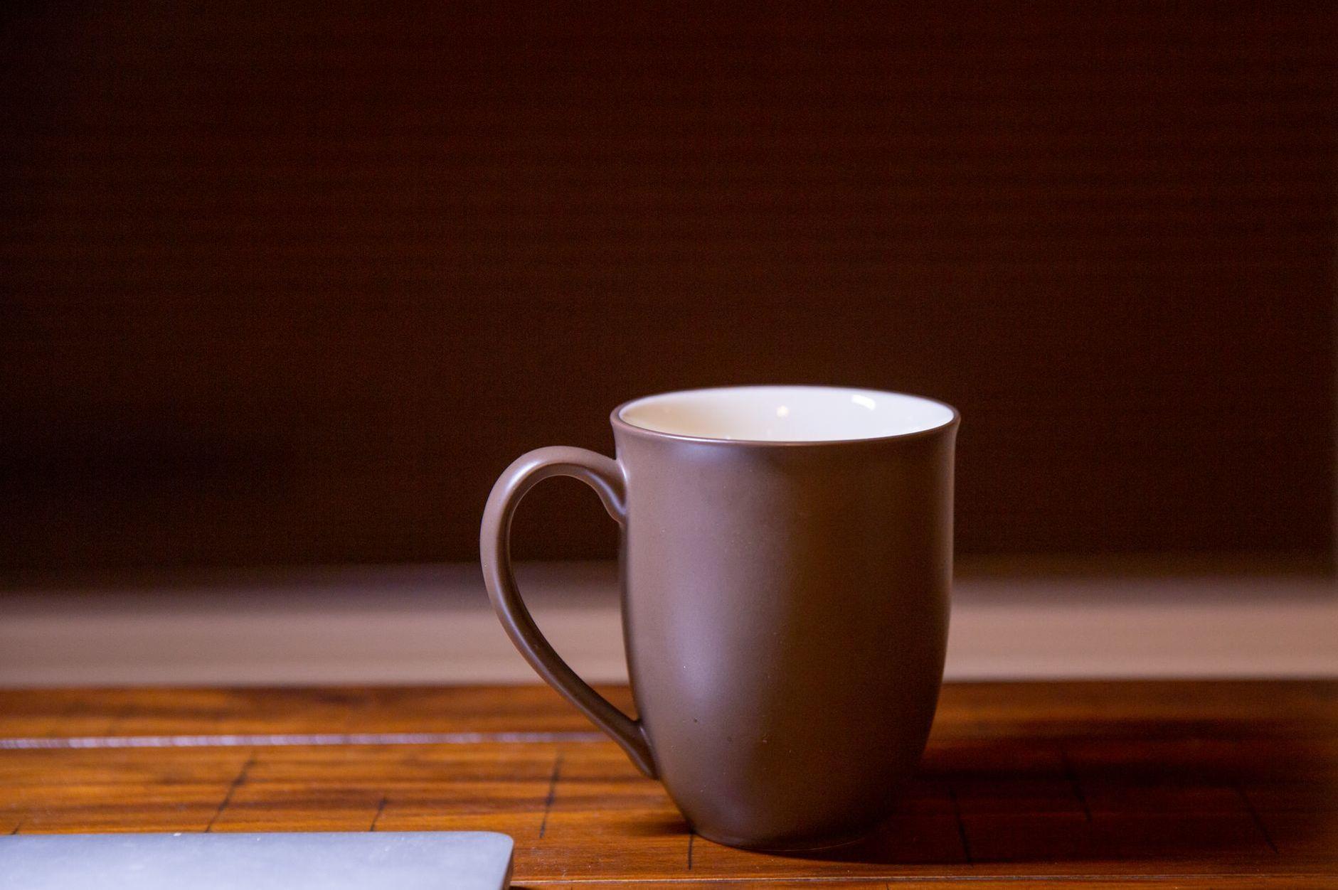 General visual reference for A Respected Figure in the Digital Age. Source: Pexels / Photo by Jin He / Pexels License / https://www.pexels.com/photo/minimalist-brown-mug-on-wooden-surface-31046284/