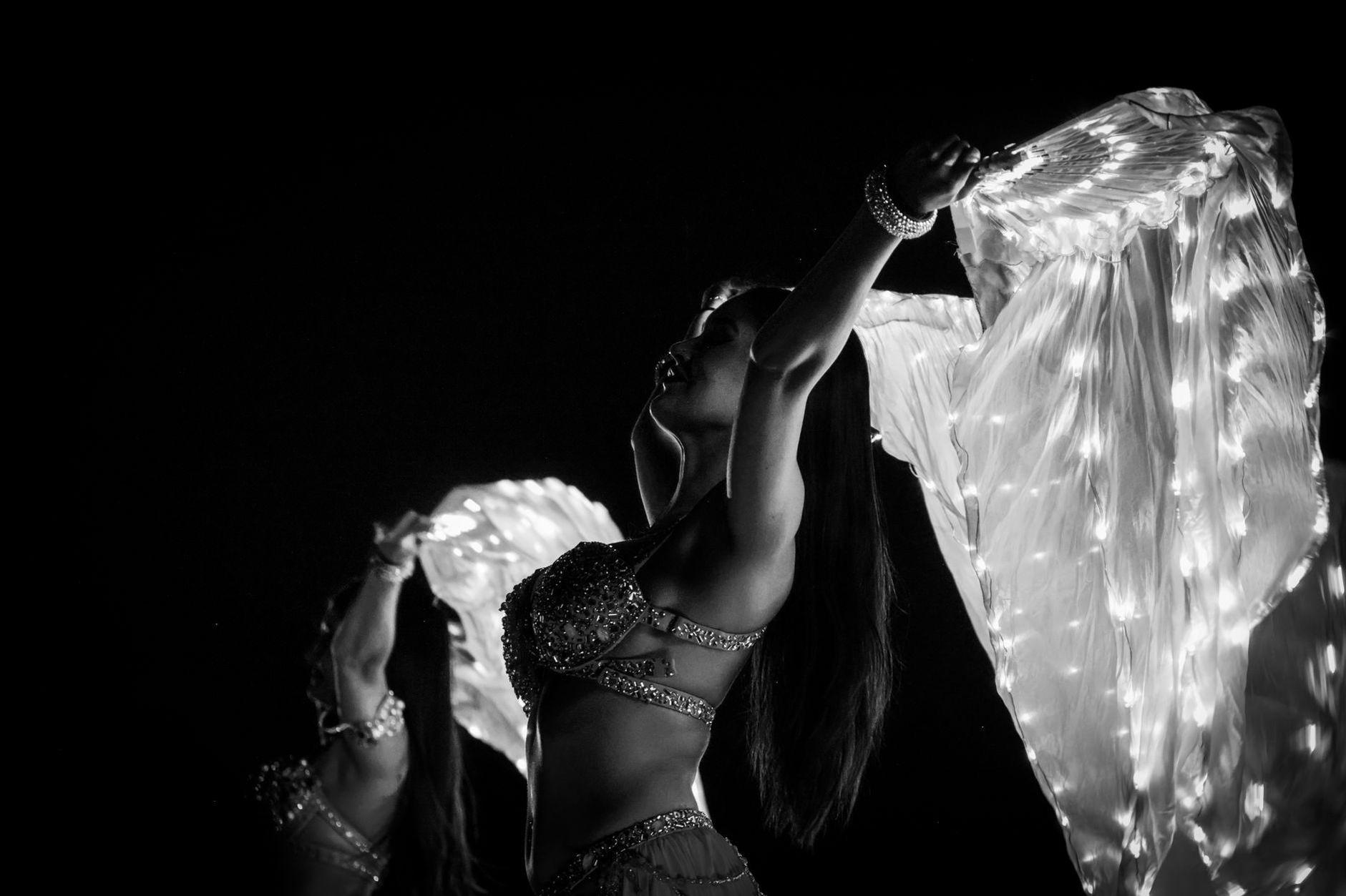 General visual reference for The Significance of Her Signature Dancing. Source: Pexels / Photo by Magda Ehlers / Pexels License / https://www.pexels.com/photo/elegant-dancers-performing-with-illuminated-scarves-35116237/