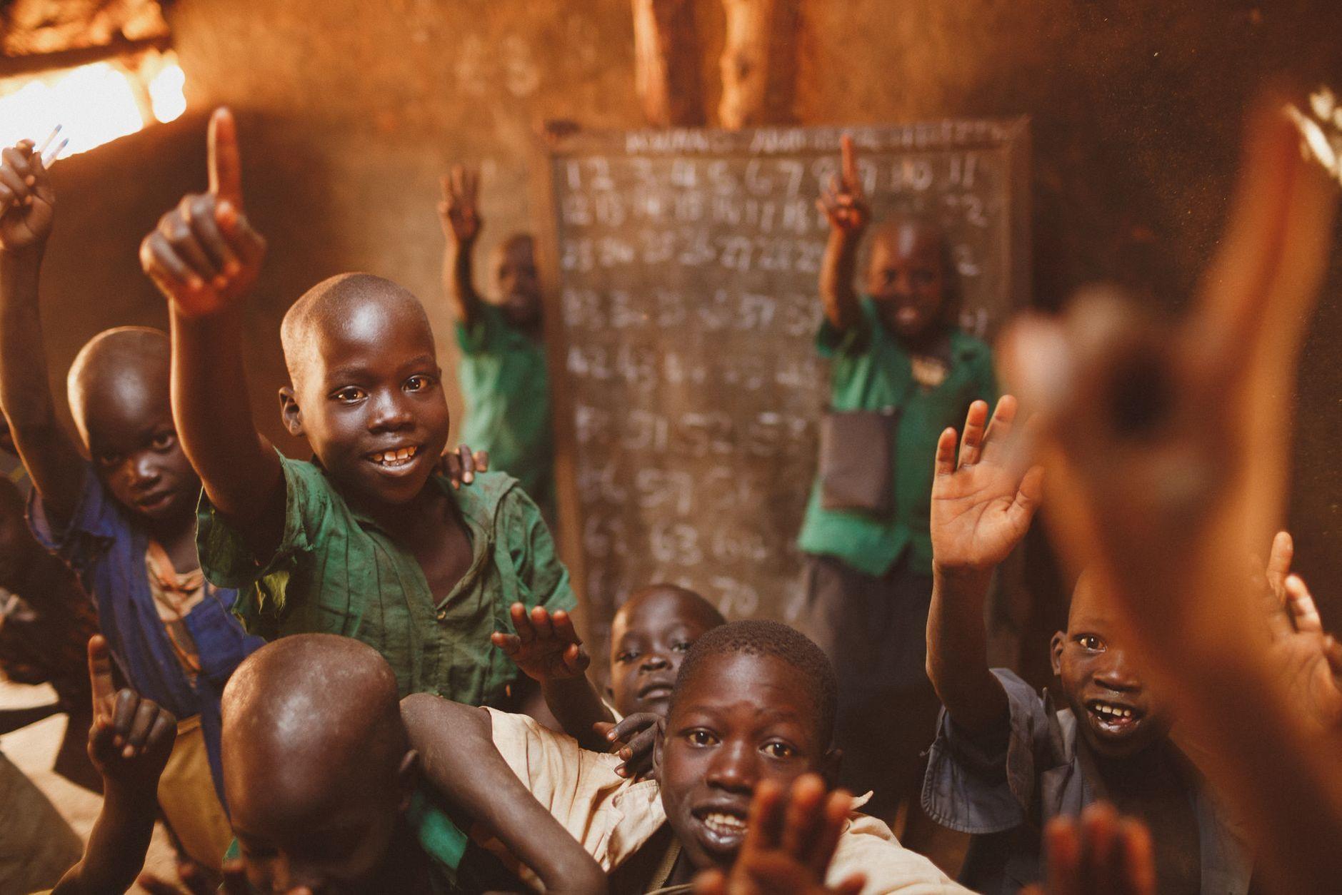 General visual reference for Philanthropy and the Pies Descalzos Foundation. Source: Pexels / Photo by illustrate Digital Ug / Pexels License / https://www.pexels.com/photo/smiling-boys-standing-with-arms-raised-in-classroom-19982406/