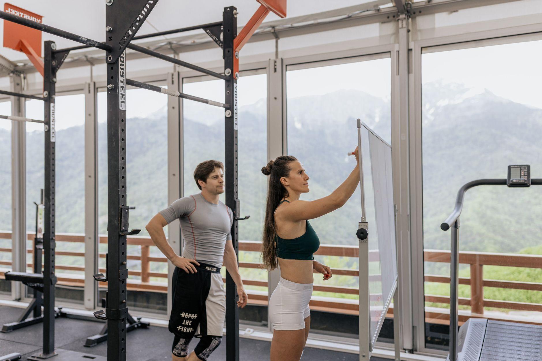 General visual reference for Bridging the Gap and Cultivating Team Chemistry. Source: Pexels / Photo by Anastasia Shuraeva / Pexels License / https://www.pexels.com/photo/woman-writing-on-a-whiteboard-at-the-gym-4944958/