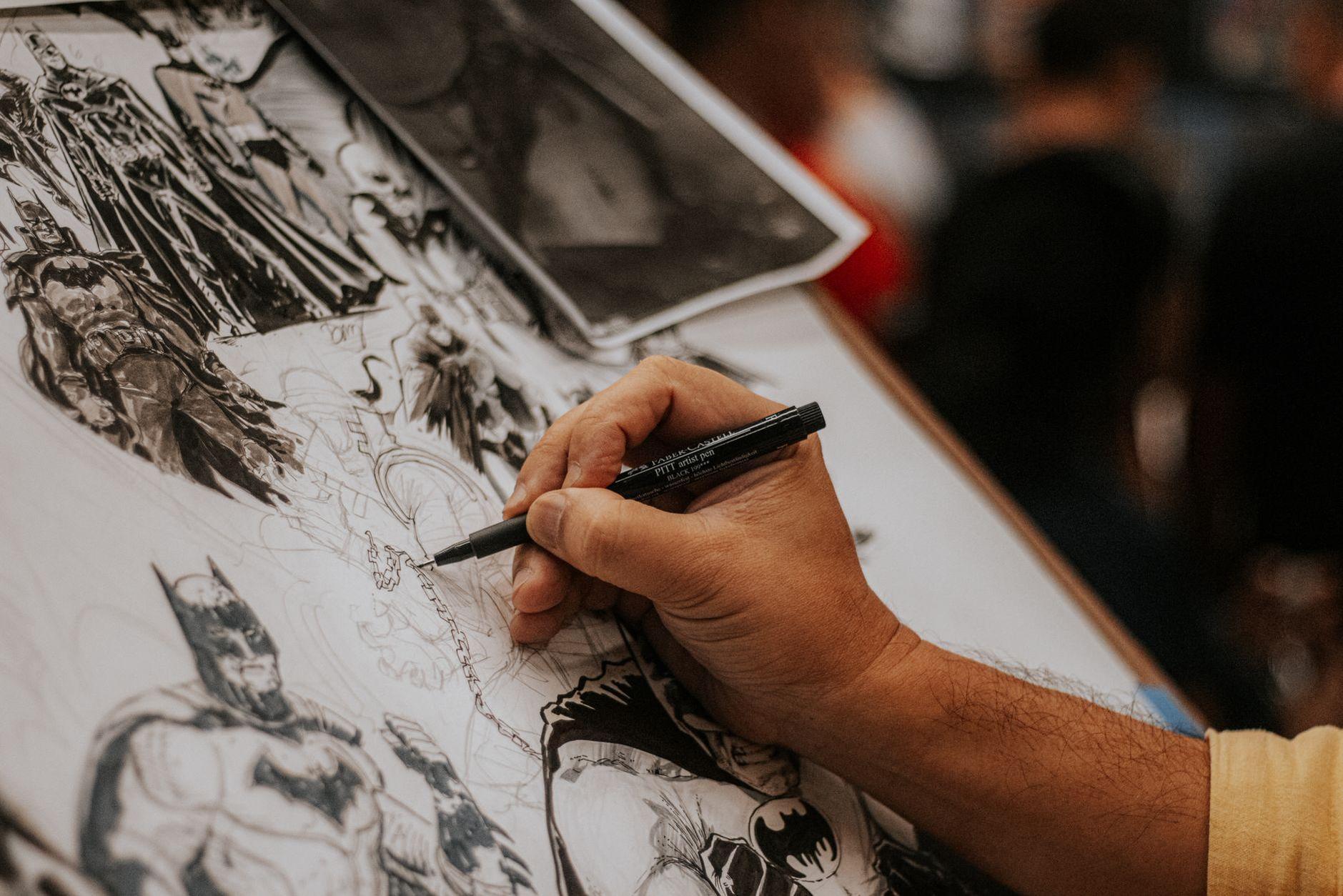 General visual reference for Early Career and Versatility. Source: Pexels / Photo by Gabriel Farias / Pexels License / https://www.pexels.com/photo/artist-sketching-comic-book-characters-at-event-33495060/