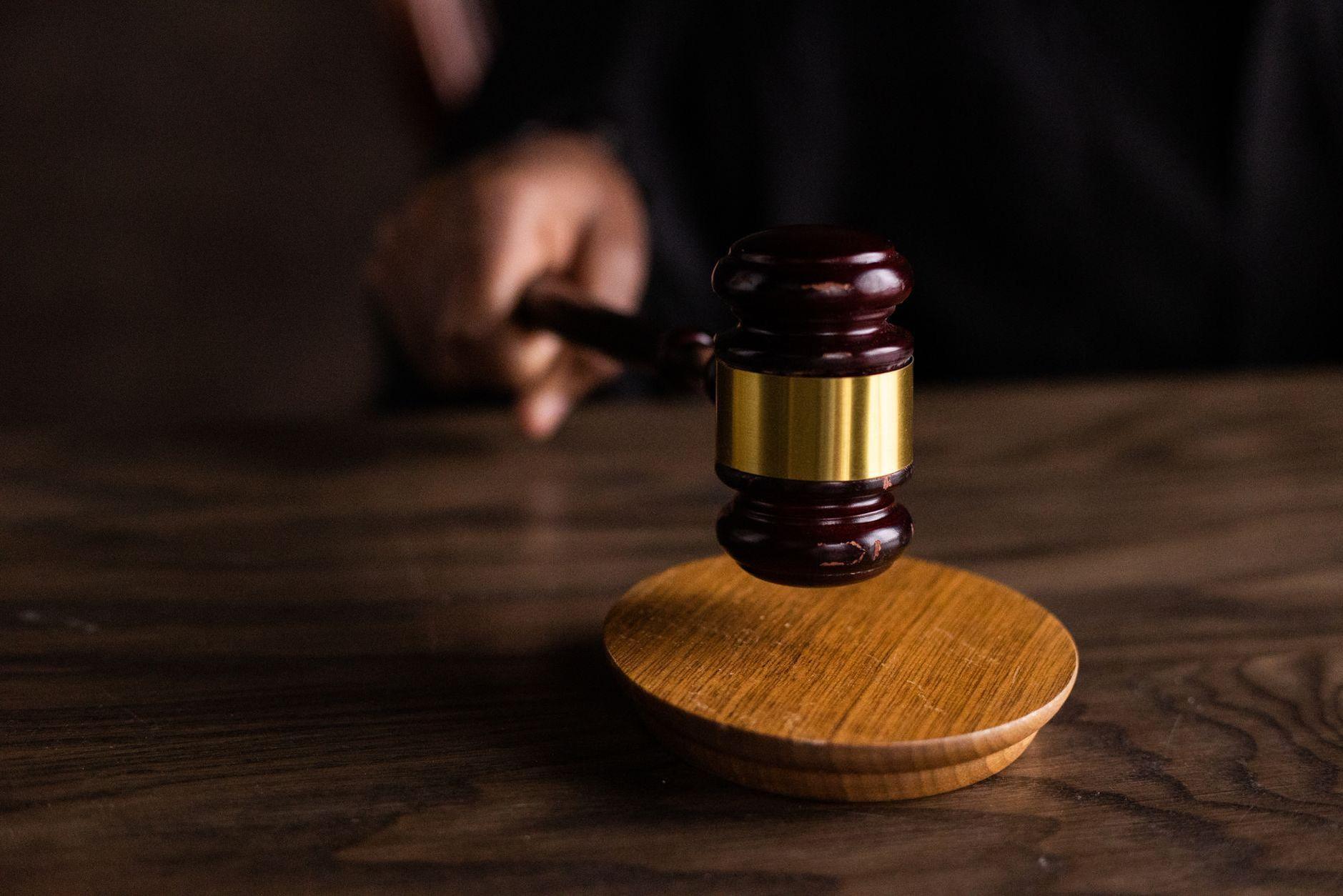 General visual reference for Social Impact and Activism: 'Silenced' and Legislative Change (2011). Source: Pexels / Photo by KATRIN BOLOVTSOVA / Pexels License / https://www.pexels.com/photo/brown-wooden-gavel-on-brown-wooden-table-6077326/