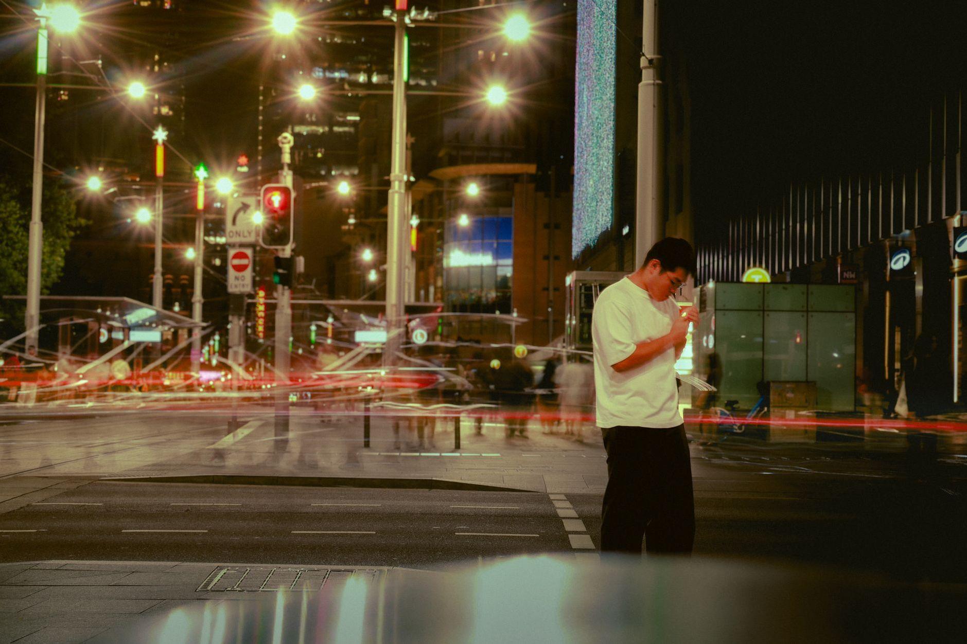 General visual reference for Reflection of Modern Work Culture and Burnout. Source: Pexels / Photo by Murun. E / Pexels License / https://www.pexels.com/photo/urban-night-scene-with-blurred-motion-and-pedestrian-35357349/