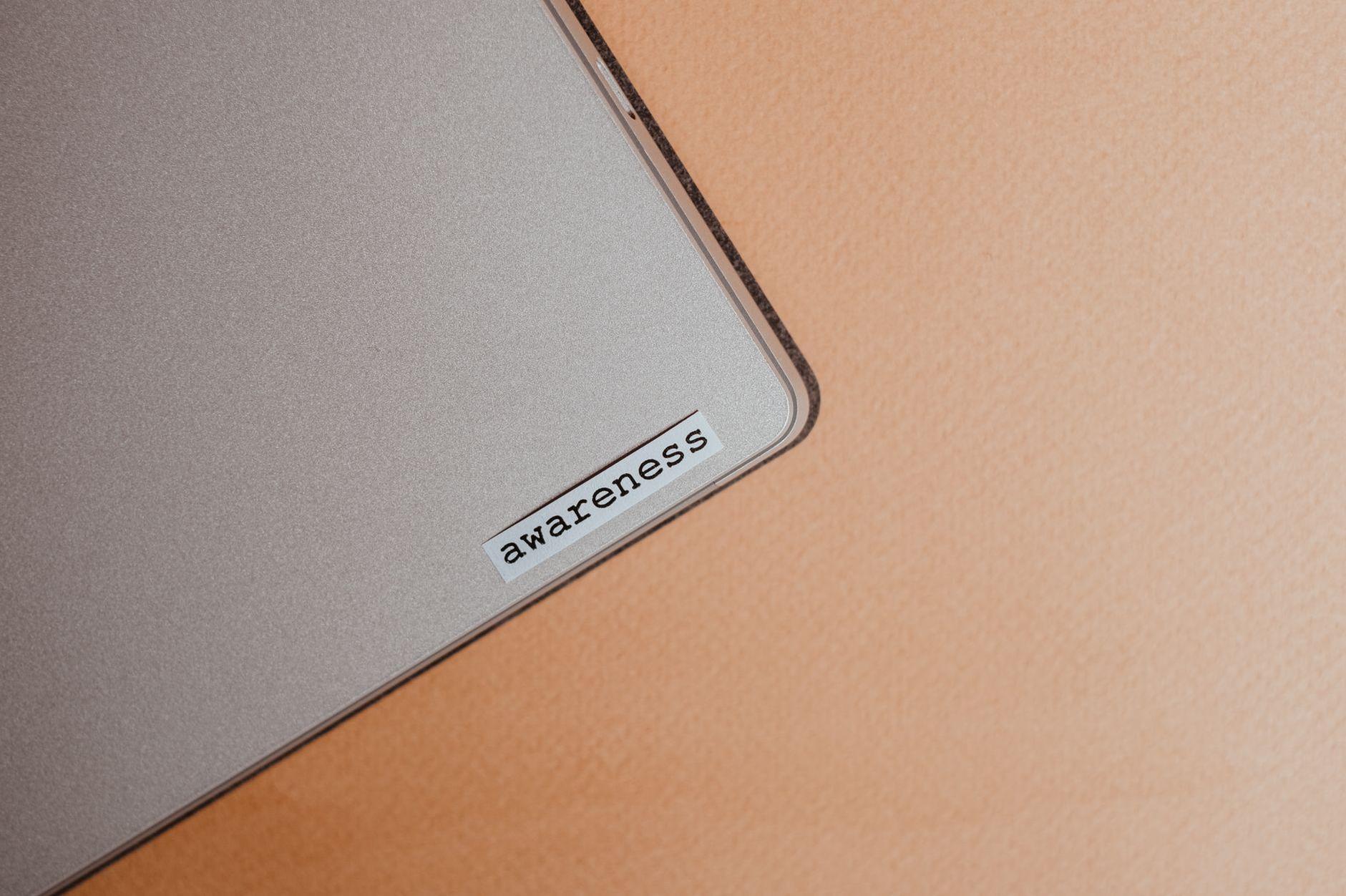 General visual reference for Merchandise and Commercialization. Source: Pexels / Photo by Vie Studio / Pexels License / https://www.pexels.com/photo/awareness-sticker-on-laptop-7004952/