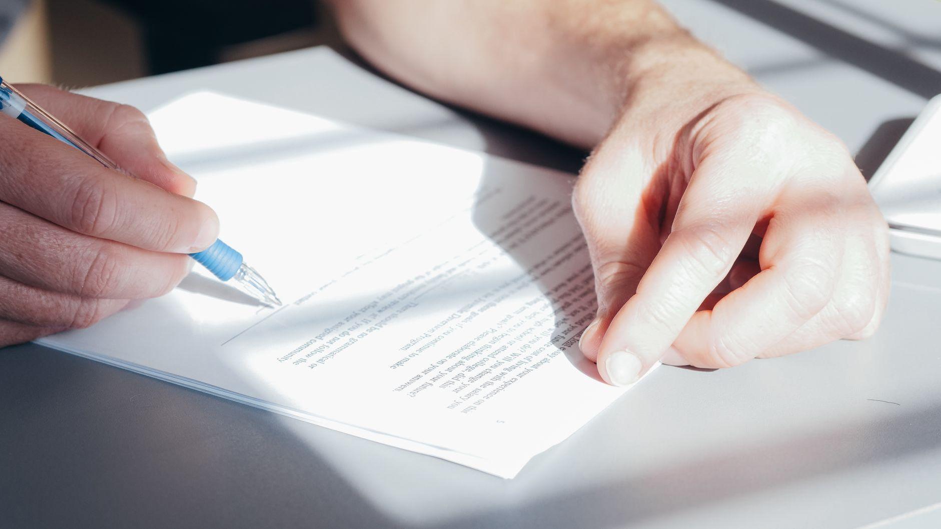 General visual reference for Intellectual Property and Copyright Challenges. Source: Pexels / Photo by Kindel Media / Pexels License / https://www.pexels.com/photo/a-person-signing-a-document-7054502/