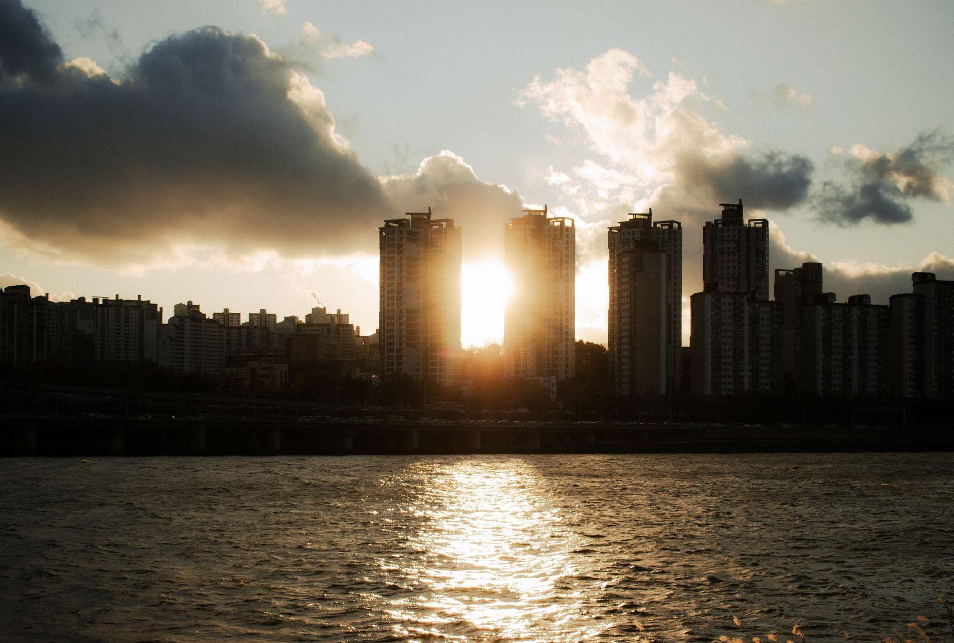 General visual reference for Legacy and Continuing Influence. Source: Pexels / Photo by Junsu Park / Pexels License / https://www.pexels.com/photo/sunset-sunlight-over-buildings-on-sea-coast-in-seoul-19535710/